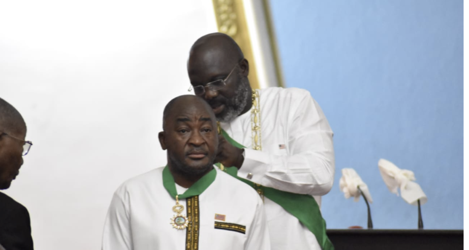 H. E. President Weah decorating Foreign Minister Kemayah at Liberia’s 176th Independence Anniversary Celebration   